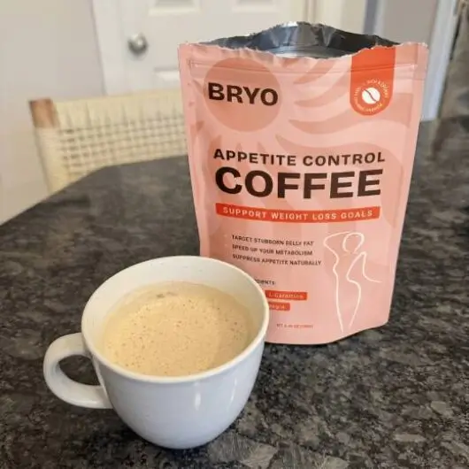 BRYO Coffee pouch beside a prepared cup of coffee